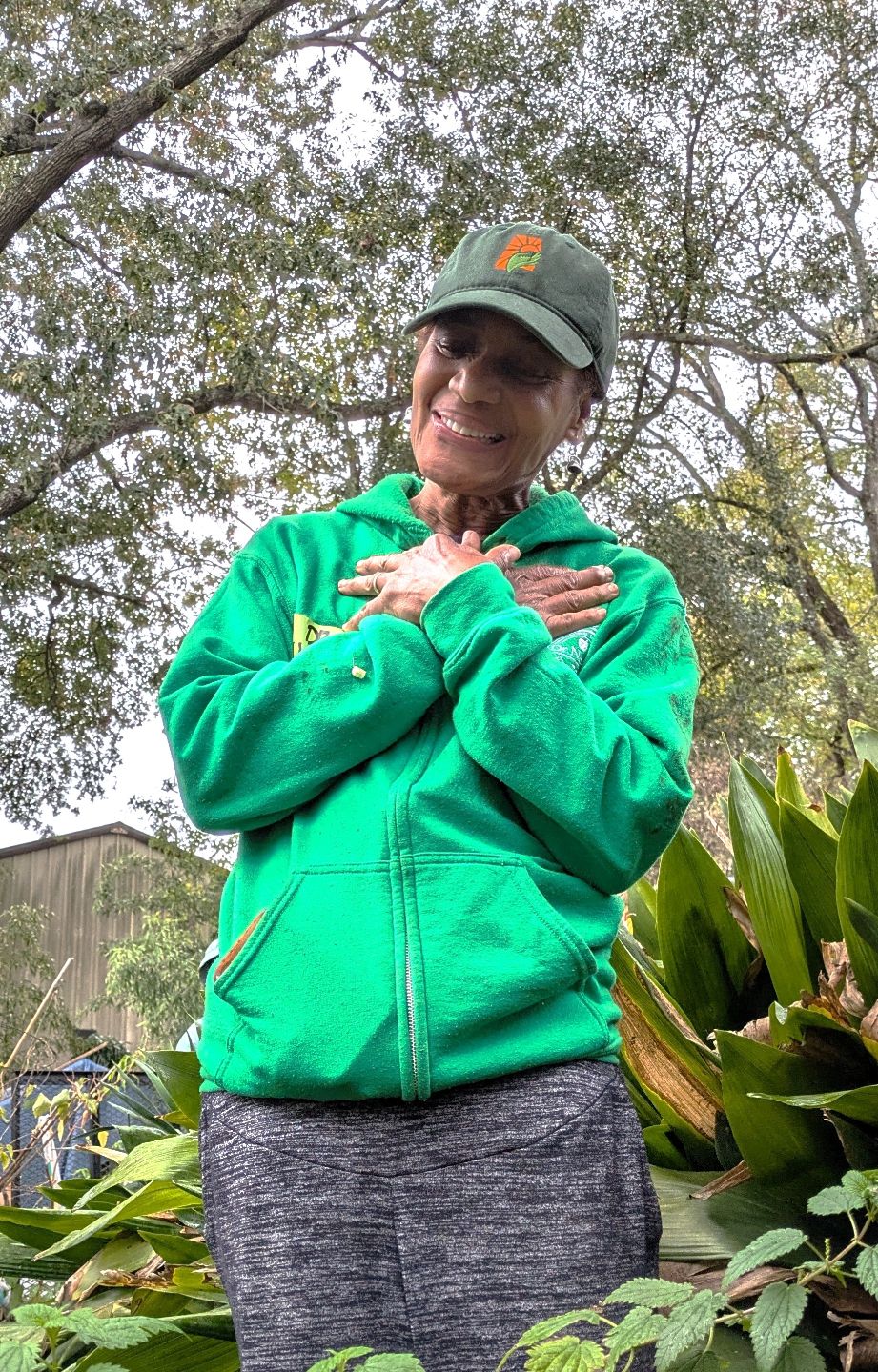 WomanHandsOnChestGreenJacket%20(1).jpg
